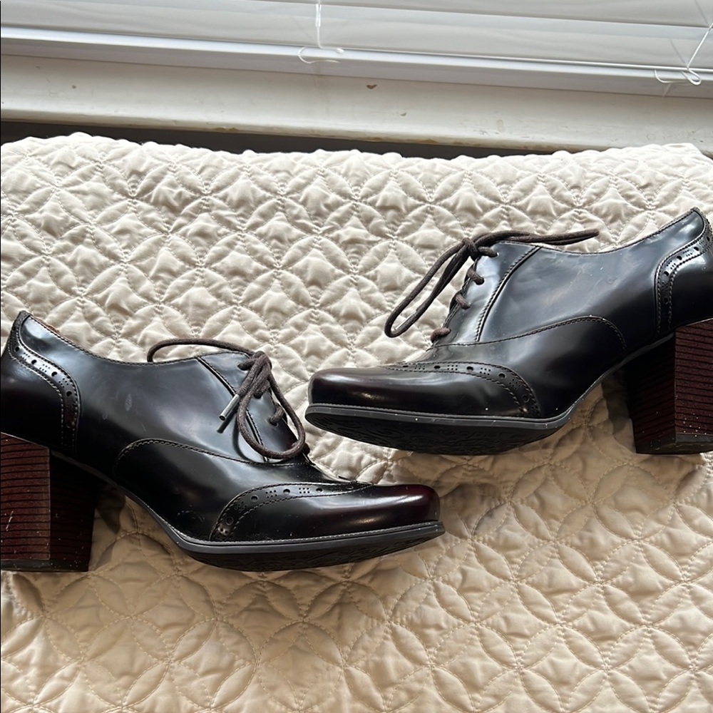 Clarks Black Heels with Chunky Block Heel and Lace-Up Design has a few scratches